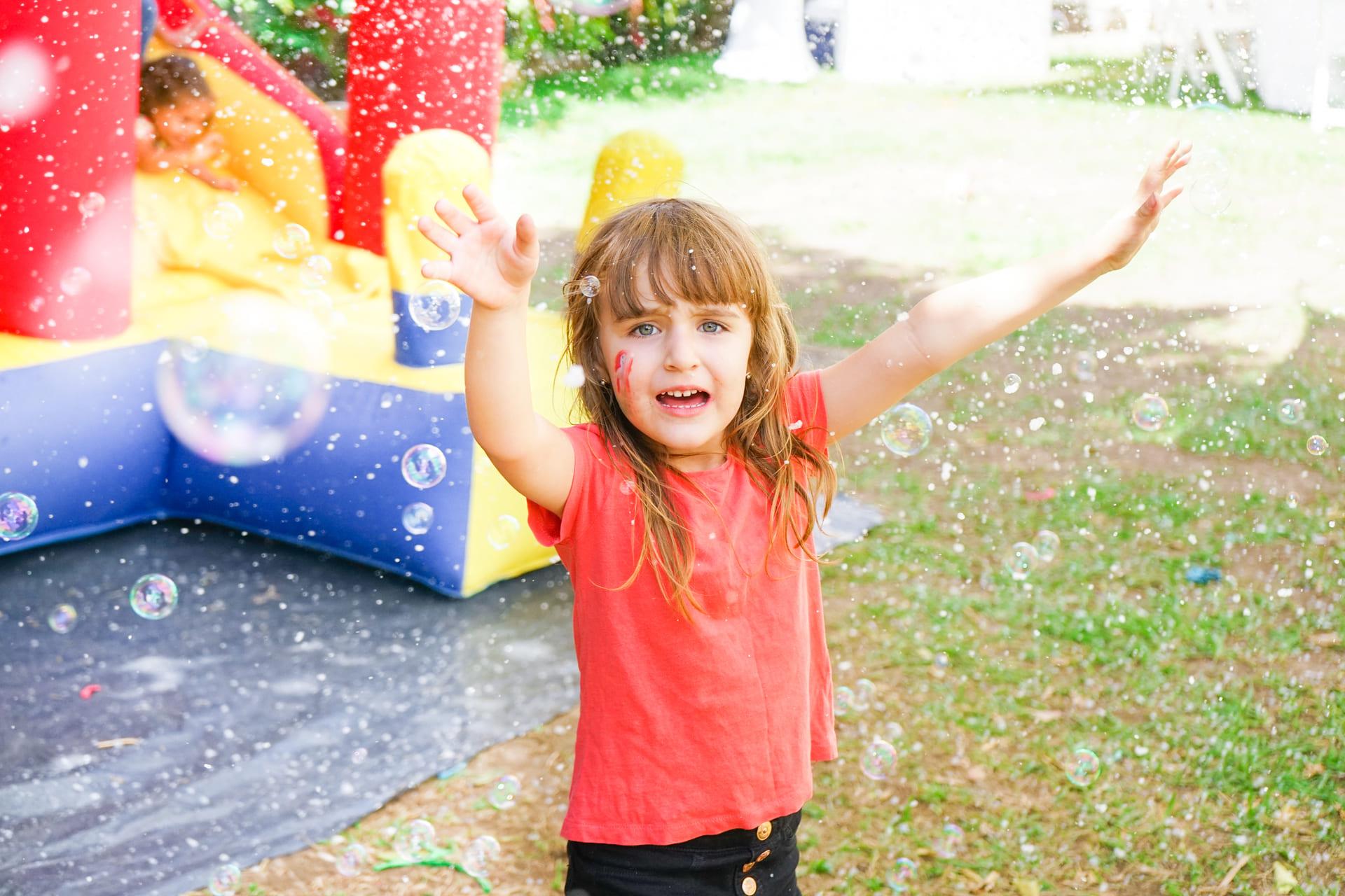 enthusiastic-girl-enjoying-bubbles-at-an-outdoor-p-2026-01-11-08-09-27-utc (1) About Us Bounce House Rentals, Delaware About us